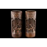 A Pair of Chinese Carved Bamboo Blush Pots Bitong, carved figures and trees. Height 10.25".