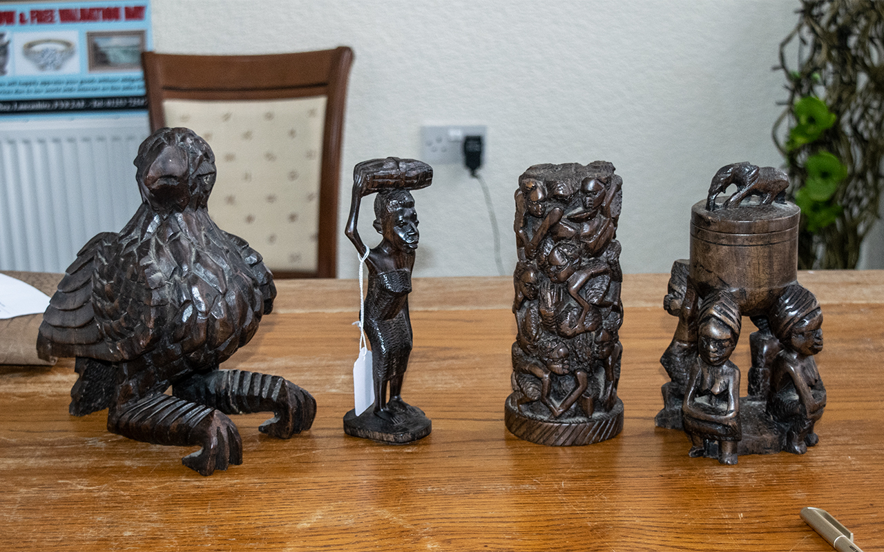 Collection of Four Wooden Carvings comprising a 8" figure of a woman,