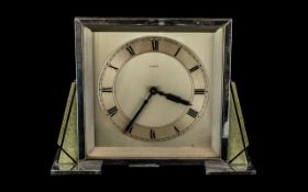 An Art Deco Chrome Mantle Clock, square cased, silver chapter dial with Roman numerals,