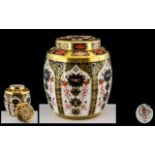 A Royal Crown Derby 1128 Cigar Pattern Ginger Jar and Cover height 4 1/2 inches.