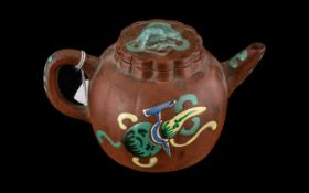 A Chinese Small Clay Tea Pot Yixing, decorated in coloured enamels, height 3.25".