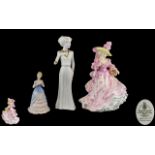 A Trio of Hand Painted Porcelain Figures