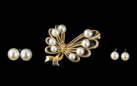 9ct Gold Stylized Ribbon Brooch. Set With Seed Pearls 28 x 39mm.