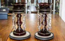 A Pair of Victorian Ruby Glass Lustres, with glass prisms, gilt highlights,