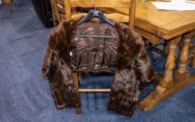 Ladies Mink Stole, in dark brown with sateen lining, with collar and wrap style. In good condition.