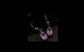 Pair of Amethyst Drop Earrings, oval cut solitaire amethysts of 2cts, classically set,