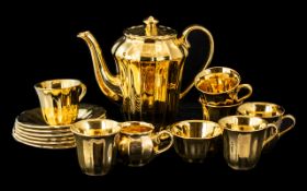 Wade Gold Tea Set, comprising a teapot, milk jug and sugar bowl, and six cups and saucers,