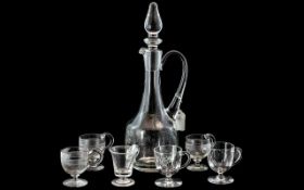 Glass Wine Decanter together with six glasses with handles and footed base.