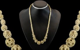 Antique Persian Attractive Carved Ivory Beaded Necklace, with puzzle ball design drops.