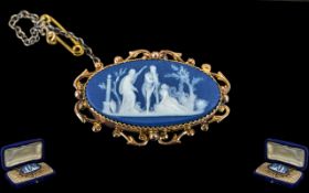 An Antique Blue Jasper Ware Oval Cameo, set in a 9ct gold mount, depicting a classical scene.