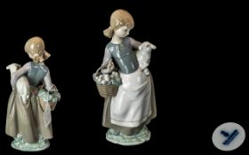 1 Lladro Figure ' Girl with Basket and Lamb ' Stamped to Base. Approx 10 Inches High.