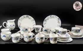 Royal Doulton 'Expressions' Tea Service, comprising six small teacups and saucers,
