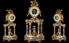 A French Marble And Gilt Bronze Mantle Clock in the Louis XV1th Style,