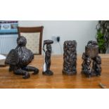 Collection of Four Wooden Carvings comprising a 8'' figure of a woman, a bowl suspended on the heads