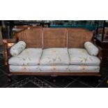 An Early 20th Century Mahogany Framed Bergere Suite, cane backs and sides, stuffed seat cushions,