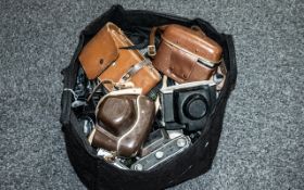 A Large Bag Containing a Quantity of Mid to Late 20th Century Cameras, makes and models to include,