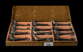 Boxed Collection of Twelve Art Deco Pewter Knife Rests, all in the form of birds,