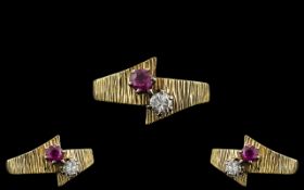 18ct Gold - Attractive and Contemporary Designed Ruby and Diamond Set Two Stone Ring. Marked 18ct to