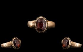 9ct Gold Ladies Dress Ring With Central Large Faceted Garnet Measuring 9x7mm, Gross Weight 2.