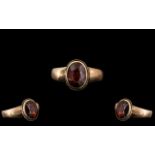 9ct Gold Ladies Dress Ring With Central Large Faceted Garnet Measuring 9x7mm, Gross Weight 2.