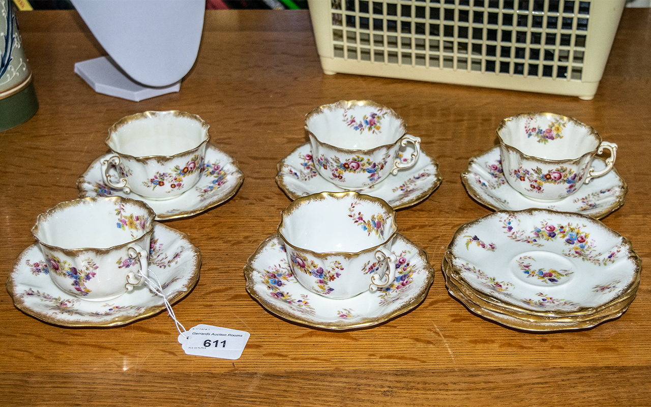 Osler Calcutta Set comprising five teacups and eight saucers, with decorative pattern.