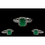 Ladies 10ct White Gold - Attractive Diamond and Emerald Set Dress Ring of Pleasing Design.