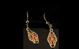 Orange Sapphire Lozenge Shape Drop Earrings, an attractive setting of four oval cut,