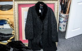 Beautiful Black Astrakhan Coat, with black mink collar, made by Raimond Furs of Manchester.