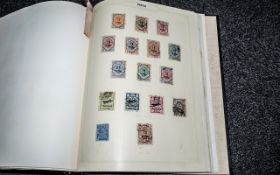 Black Spring Back Stamp Album containing countries with initial H to I.