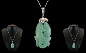 Chinese Jade Pendant in the Form of Two Fish, attached to a 925 silver chain, marked for silver.