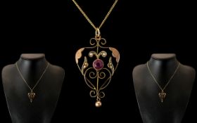 9ct Gold Art Nouveau Pendant Set With A Central Amethyst And Split Seed Pearls,