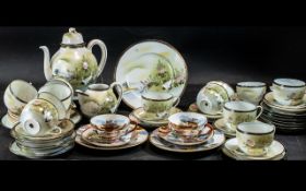 Quantity of Oriental Porcelain, comprising a large teapot, nine teacups, 12 saucers, 12 side plates,