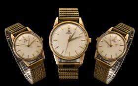 Gents 9ct Gold Omega Automatic Wristwatch cream dual, baton numerals with centre seconds.