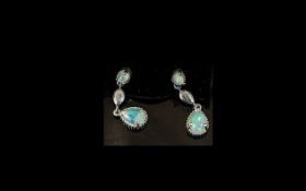 Pear Drop Shape Opal Pendant Earrings, each earring with a larger pear cut opal, below a smaller,