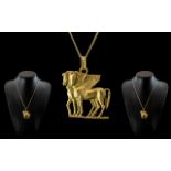 18ct Gold Designer Pendant In The Form Of Pegasus 45 x 37mm Suspended On A 18ct Gold Chain.