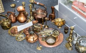 Large Collection of Brass & Copper, including brass and glass candlesticks, copper dishes on stands,