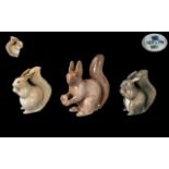 Royal Copenhagen and Bing and Grondahl Fine Trio of Hand Painted Porcelain Squirrel Figures. c.