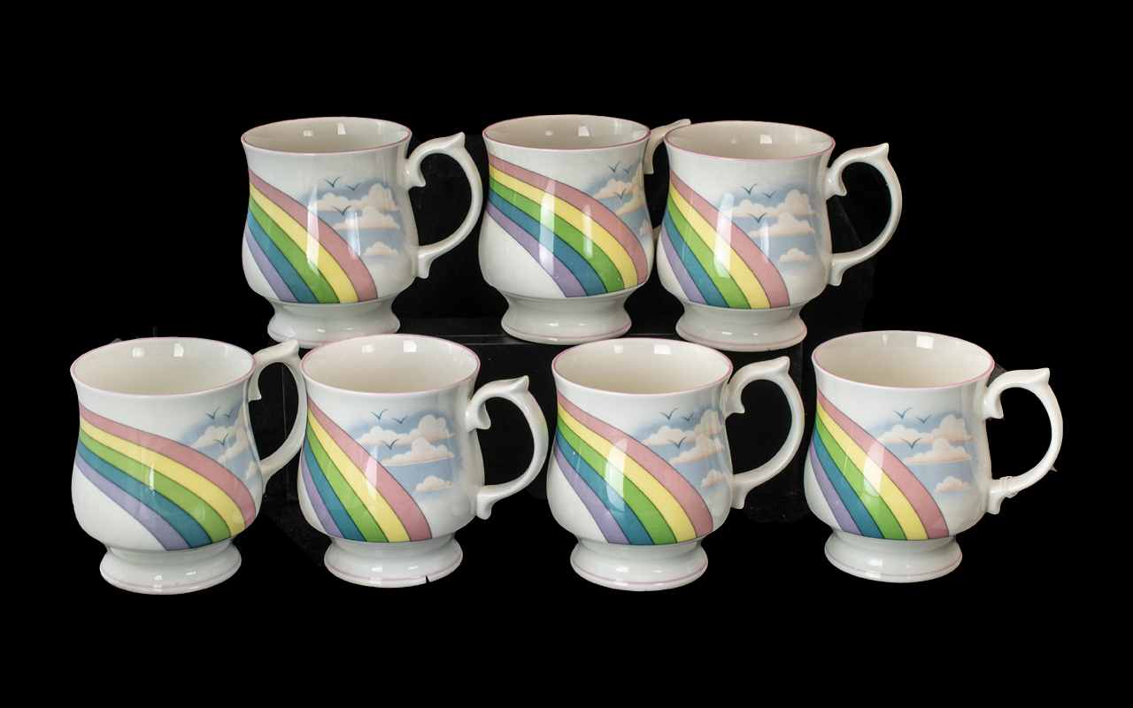 Collection of Elizabethan Staffordshire Mugs, in fine bone china, white with rainbow design.
