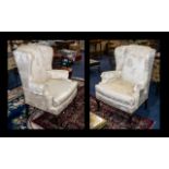 Two Antique Wing Back Armchairs, upholstered in cream embossed damask fabric,