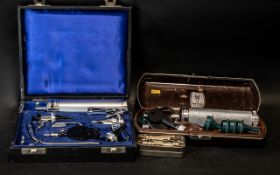 A Collection of Medical Equipment to include a Ophthalmoscope, diagnostic set, and a syringe.