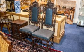 A Pair of Two Carved Antique Oak Stand Chairs carved throughout with lion masks.