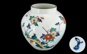 Japanese Kakiemon Style Bulbous Vase, decorated in coloured enamels depicting birds amongst flowers;