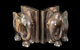 Pair of Carved Wood Bookends in the form of Elephants. Measure 6.5" tall by 6" wide approx.