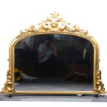 A gilt framed overmantel mirror.