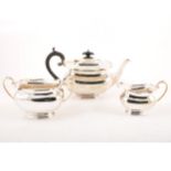 A three-piece silver tea set by Jenkins & Timm, Sheffield 1924