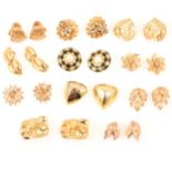 Eleven pairs of large gilt metal clip on earrings, Trifari, Sphinx, Sarah Coventry,