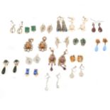 Seventeen pairs of vintage costume jewellery earrings in the antique style.