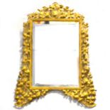 A pierced gilt metal easel mirror.