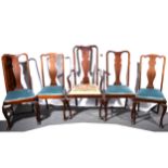 Edwardian mahogany wind out dining table and a set of six dining chairs