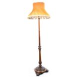A Victorian style walnut and gilt standard lamp